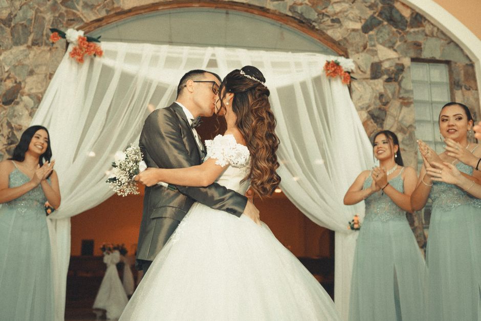 Wedding ceremony first kiss captured by wedding photographer